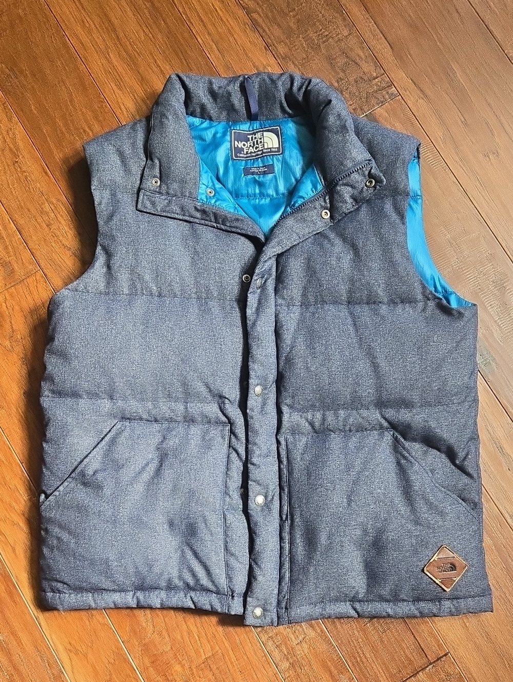 The North Face Men’s Heather Navy Puffer Vest with Bright Blue Lining Large